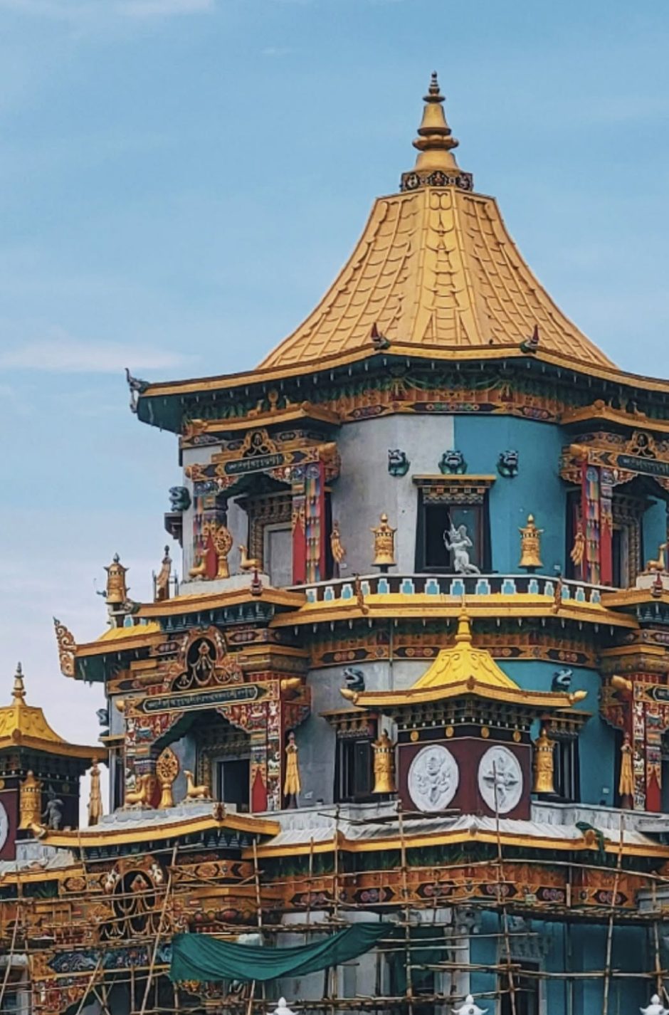 The painted tiers and gilded roof of Zangdok Palri.