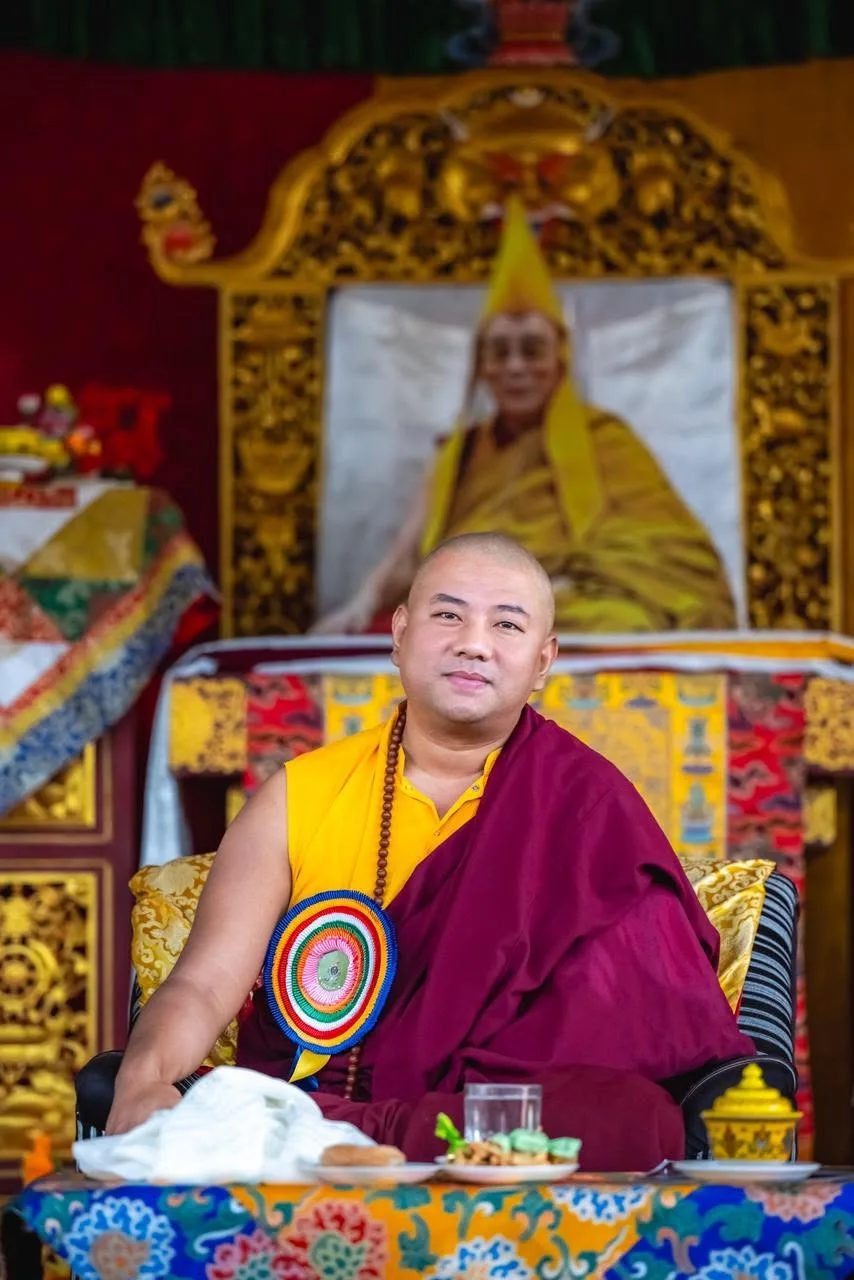 Lama Sonam Tashi Rinpoche seated before the throne of His Holiness Dudjom Rinpoche.